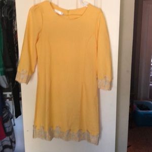 Yellow shift dress with lace accents